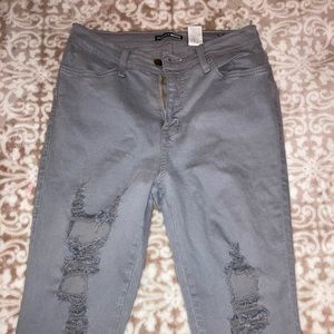 Gray high waisted ripped jeans.